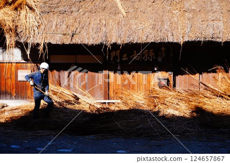 Shirakawa-go Thatched roof Re-roofing craftsman Shirakawa-go Thatched roof Re-roofing craftsman 124657867