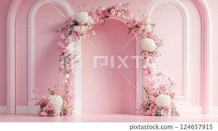 A wedding backdrop with flower arch in pink and white. 124657915