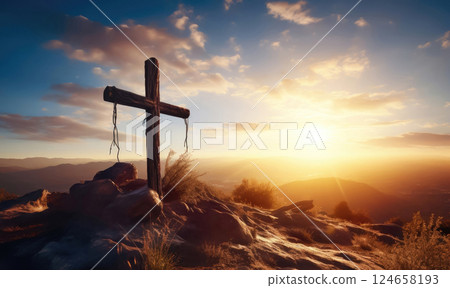 Divine Light: Wooden Cross on Mountain Peak 124658193