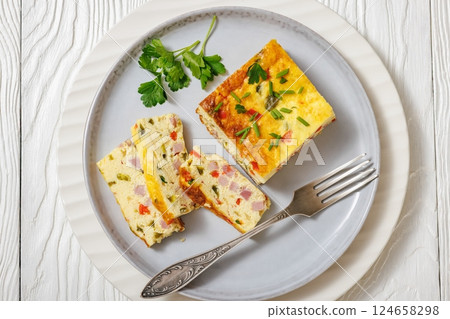 Baked Denver Omelette on a plate with fork 124658298