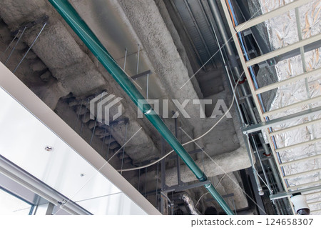 Steel frame with rockwool fireproof coating, air conditioning ducts, and cable racks 124658307