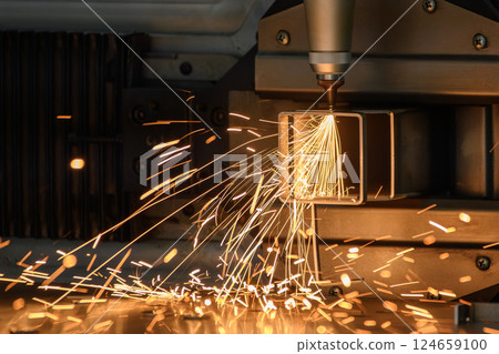 Close up scene the fiber laser cutting machine cut the square shape stainless steel tube with sparkling light. Close up scene the fiber laser cutting machine cut the square shape stainless steel tube with sparkling light. 124659100