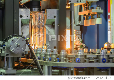 The drinking water bottle manufacturing process by blow mold machine. 124659102