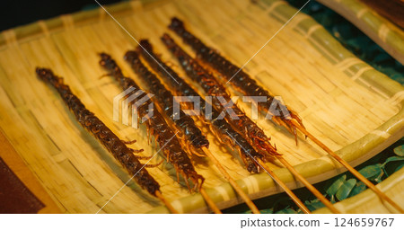 Chengdu, Sichuan, China. Fried Centipede Skewers. Cooked Insects Thread On Skewers. Popular Snacks In Southeast Asia. New Source Of Protein , Lipids, Minerals, And Vitamins. Modern Food Concept. Fried 124659767