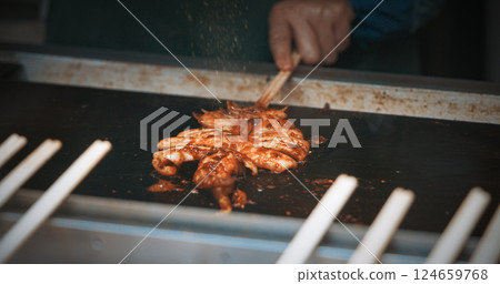Chengdu, Sichuan, China. Man Frying Squid. Traditional Chinese Snacks. Fried Squid With Green Onions. Chinese Street Food. Street Barbecue. Asian Street Food. Asian Cuisine. Man Frying Squid In Slow 124659768