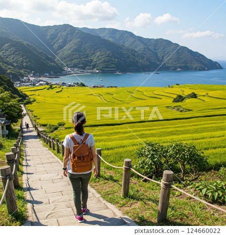 Woman traveling through rice terraces Woman traveling through rice terraces 124660022