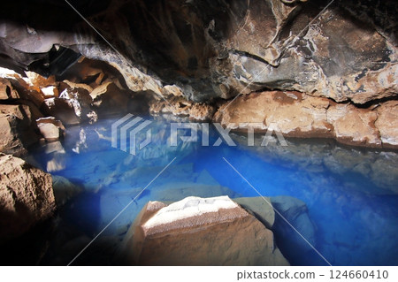 Beautiful cave hot springs in Iceland 124660410