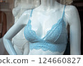 Closeup of blue bra on mannequin in a fashion store showroom 124660827
