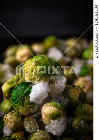 Frozen Brussels sprouts on dark background 124661634