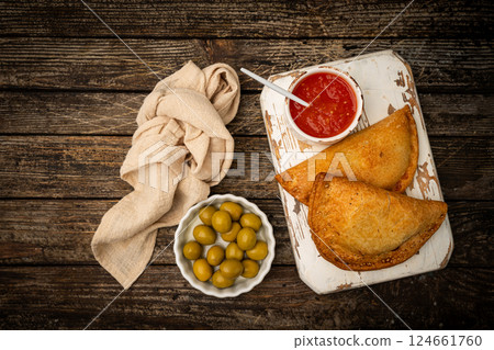 Traditional baked Spanish empanadas 124661760