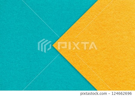 Texture of turquoise paper background, half two colors with yellow arrow, macro. Structure cerulean craft cardboard Texture of turquoise paper background, half two colors with yellow arrow, macro. Structure cerulean craft cardboard 124662696