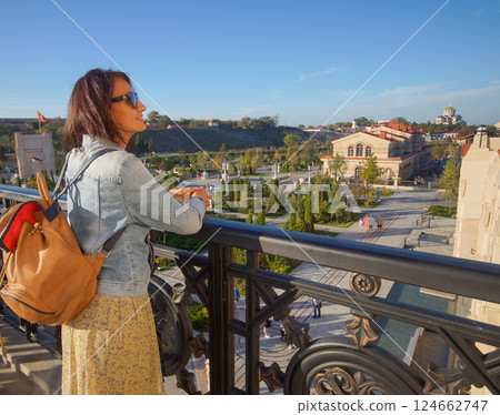 Crimea, Sevastopol. Museum and temple complex New Chersonesos. A woman walks in the new park of Chersonesus 124662747