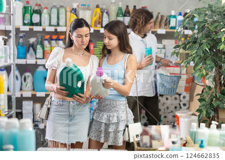 Family shopping for household goods in local supermarket 124662835
