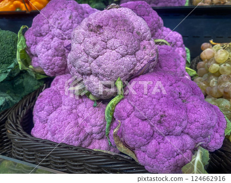 Purple cauliflower lies on the counter in the store 124662916