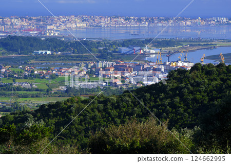 Santander industrial port and cityscape embracing the bay of santander, spain 124662995