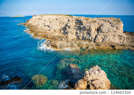 View of Kape Apostolos and Kleides Islands at the very eastern tip of the Karpasia Peninsula in the Turkish Republic of Northern Cyprus. Most easterly point on mainland Cyprus. 124663300