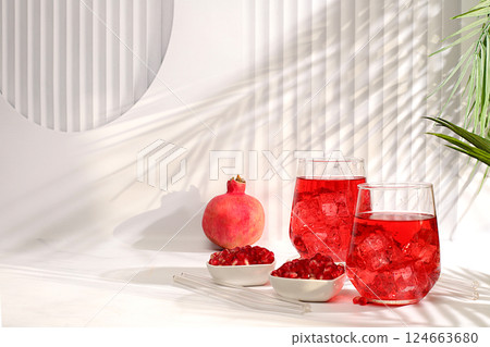 Fruit juice and ingredients, summer drink or tonic with pomegranate and ice on bright table, detox diet and weight loss concept, healthy and natural food, source of vitamin C, selective focus Fruit juice and ingredients, summer drink or tonic with pomegranate and ice on bright table, detox diet and weight loss concept, healthy and natural food, source of vitamin C, selective focus 124663680