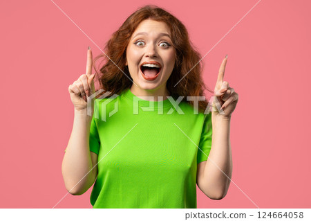 Breakthrough genius idea. Happy woman eureka moment, pointing finger up on pink Breakthrough genius idea. Happy woman eureka moment, pointing finger up on pink 124664058