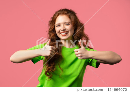 Positive woman with hand sign like, thumbs up gesture. Lady on pink background 124664070