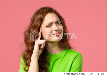 Brainy 20s aged woman with gesture - you, think about it. Looking camera on pink 124664101