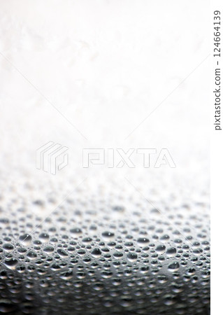 Water Condensation Small Bubbles Moisture on a Glass Window Close up Abstract Background Water Condensation Small Bubbles Moisture on a Glass Window Close up Abstract Background 124664139