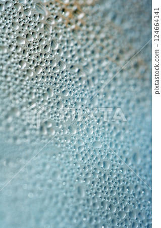 Water Condensation Small Bubbles Moisture on a Glass Window Close up Abstract Background 124664141