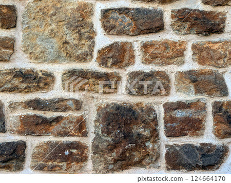 Old church wall with random handmade bricks and masonary old surface 124664170