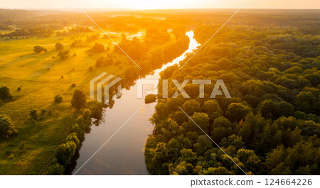 Beautiful view from a drone on the forest and river. Beautiful view from a drone on the forest and river. 124664226