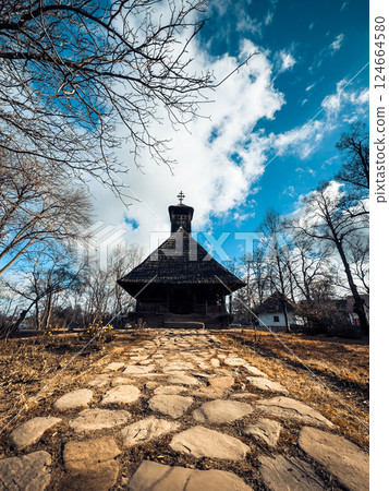 old house with stone paved driveway 124664580