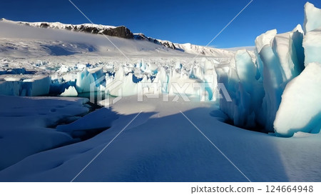 Sunlight illuminating blue glacier crevasse in Antarctica Sunlight illuminating blue glacier crevasse in Antarctica 124664948