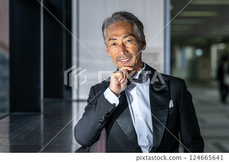 A CEO venting his anger over the phone in his office in an office building 124665641