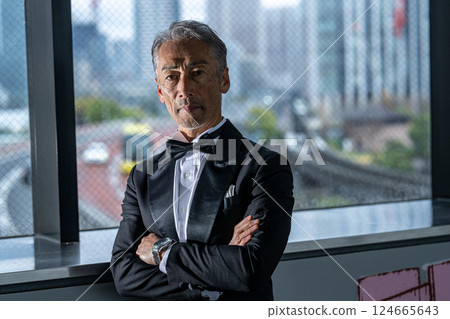 A CEO venting his anger over the phone in his office in an office building A CEO venting his anger over the phone in his office in an office building 124665643