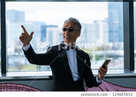 A CEO venting his anger over the phone in his office in an office building A CEO venting his anger over the phone in his office in an office building 124665652