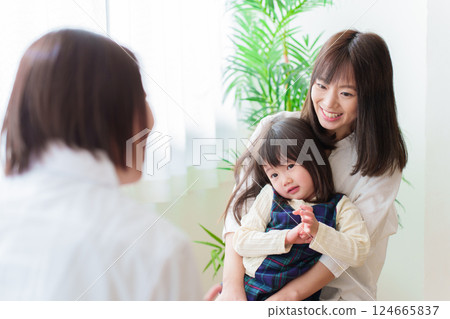 Girl receiving medical examination, pediatrician and mother Girl receiving medical examination, pediatrician and mother 124665837
