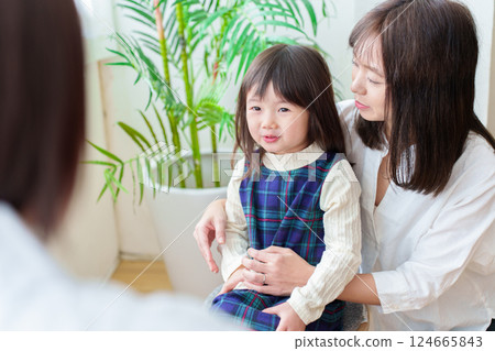 Girl receiving medical examination, pediatrician and mother 124665843
