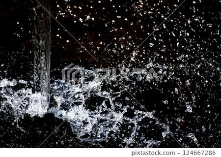 Splash and black background Splash and black background 124667286