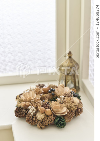 Christmas wreath decorated on a window sill Christmas image Christmas wreath decorated on a window sill Christmas image 124668274
