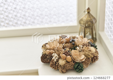 Christmas wreath decorated on a window sill Christmas image 124668277