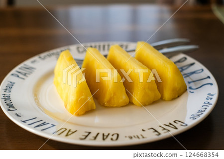 Cut pineapple on a plate Cut pineapple on a plate 124668354