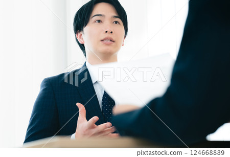 Businessman getting nervous during an interview Businessman getting nervous during an interview 124668889
