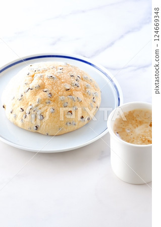 An image of enjoying a relaxing coffee break with chocolate chip melon bread and freshly brewed coffee 124669348
