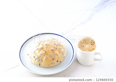 An image of enjoying a relaxing coffee break with chocolate chip melon bread and freshly brewed coffee 124669350