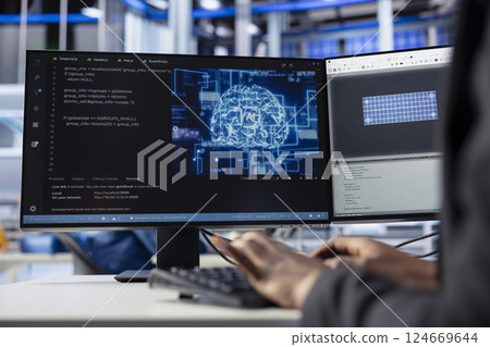 Engineer coding AI powered software at desk in solar energy plant, optimizing performance. Technician integrating artificial intelligence in photovoltaics factory production to enhance efficiency 124669644