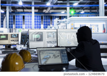 Masked worker in photovoltaics factory commits corporate espionage, looking over blueprints on PC, stealing proprietary technology. Man bypasses solar panel plant security to copy trade secrets Masked worker in photovoltaics factory commits corporate espionage, looking over blueprints on PC, stealing proprietary technology. Man bypasses solar panel plant security to copy trade secrets 124669670