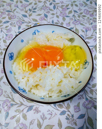 Twins with raw egg on rice Twins with raw egg on rice 124669992