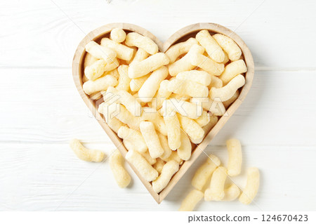 Corn sticks, concept of tasty snack food Corn sticks, concept of tasty snack food 124670423