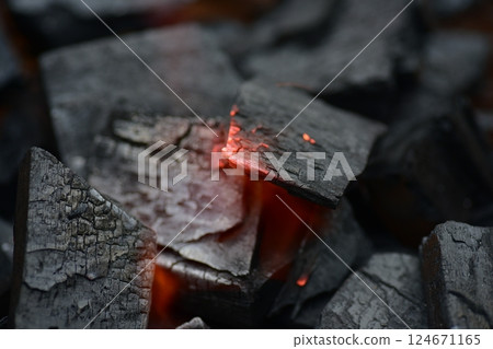 Burning charcoal 124671165