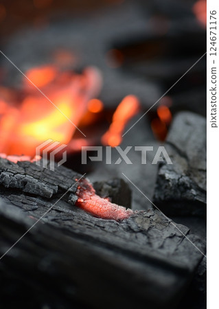 Burning charcoal 124671176