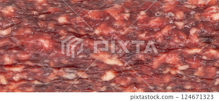Top view of smoked salami chorizo sausages texture background. Raw smoked sausage surface structure 124671323