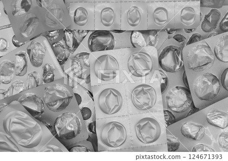 Empty pills of blister pack texture background. Empty silver blister. Used blister pill. Empty blister pack from drugs. Empty pills of blister pack texture background. Empty silver blister. Used blister pill. Empty blister pack from drugs. 124671393